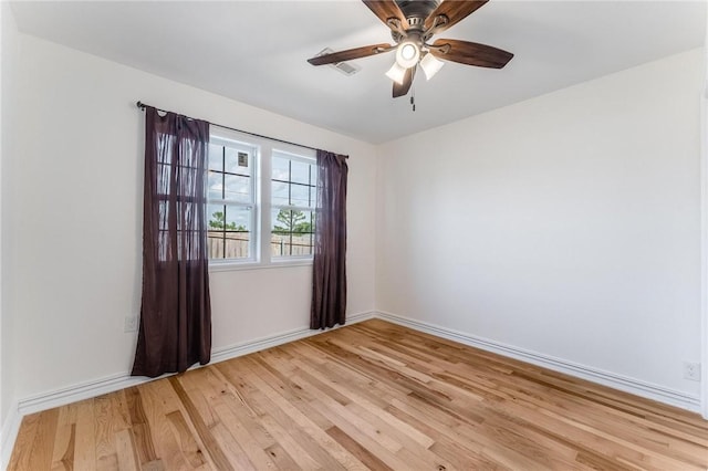 1209 W Olive St, Rogers, AR 72756 - spare room with light wood-style floors and a ceiling fan