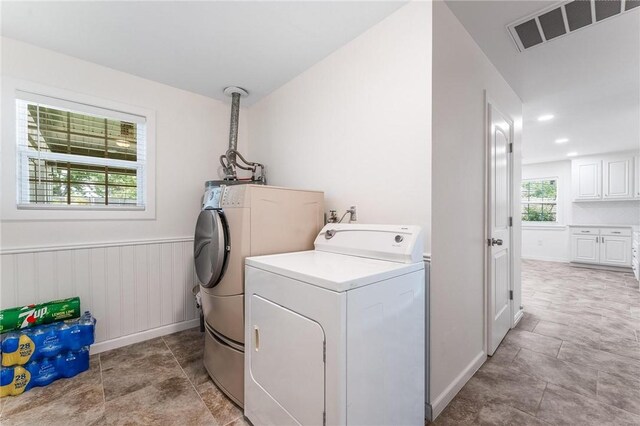 1209 W Olive St, Rogers, AR 72756 - laundry room featuring washing machine and clothes dryer and a wainscoted wall