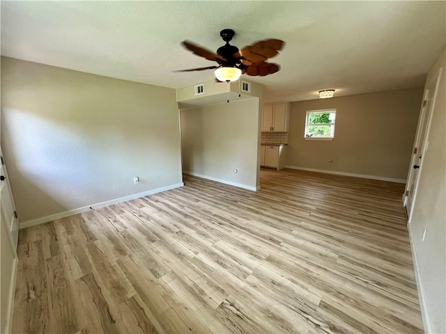 3501 Pleasant, Ozark, AR 72949 - empty room with a ceiling fan and light wood-style flooring