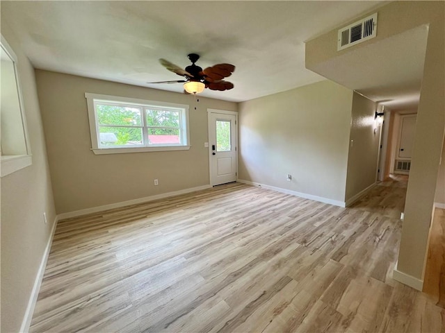 3501 Pleasant, Ozark, AR 72949 - empty room with light wood-style floors and ceiling fan