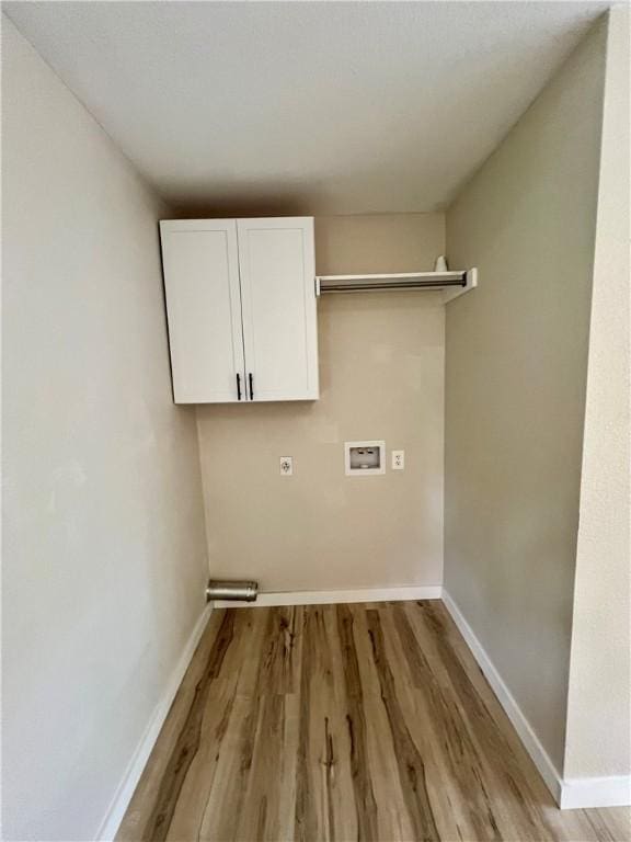 3501 Pleasant, Ozark, AR 72949 - laundry room featuring cabinet space, light wood finished floors, washer hookup, and electric dryer hookup