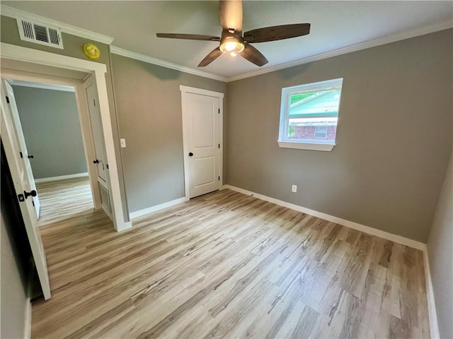 3501 Pleasant, Ozark, AR 72949 - unfurnished bedroom with light wood-style floors, ornamental molding, and a ceiling fan