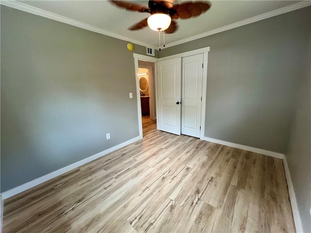 3501 Pleasant, Ozark, AR 72949 - unfurnished bedroom featuring wood finished floors, a closet, crown molding, and a ceiling fan
