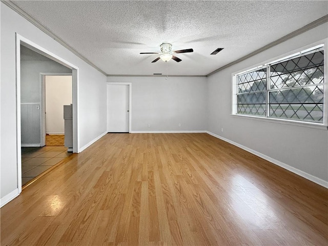 1906 S W End St, Springdale, AR 72764 - empty room featuring ceiling fan, a textured ceiling, light wood-style flooring, and ornamental molding