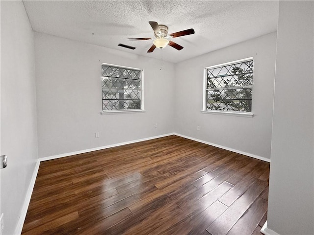 1906 S W End St, Springdale, AR 72764 - empty room with wood finished floors, a ceiling fan, and a textured ceiling