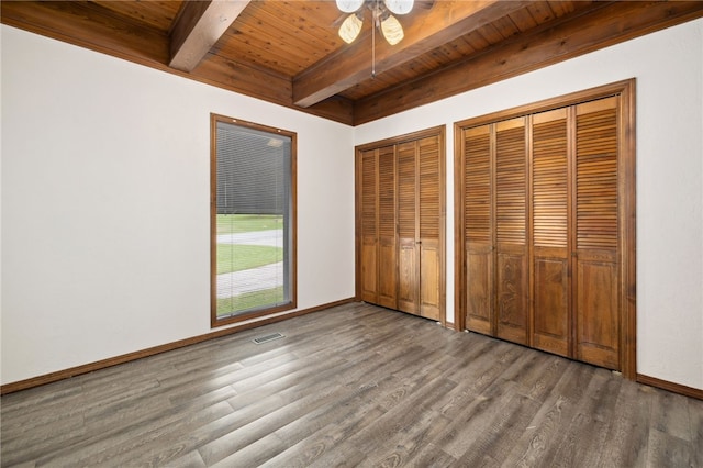 213 Suttle Dr, Springdale, AR 72764 - unfurnished bedroom featuring a wood ceiling with exposed beams, two closets, and wood finished floors