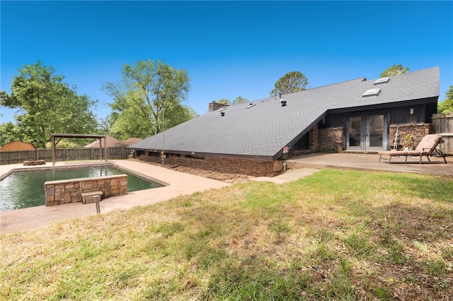 213 Suttle Dr, Springdale, AR 72764 - rear view of property with a fenced backyard, a patio, french doors, stone siding, and a chimney