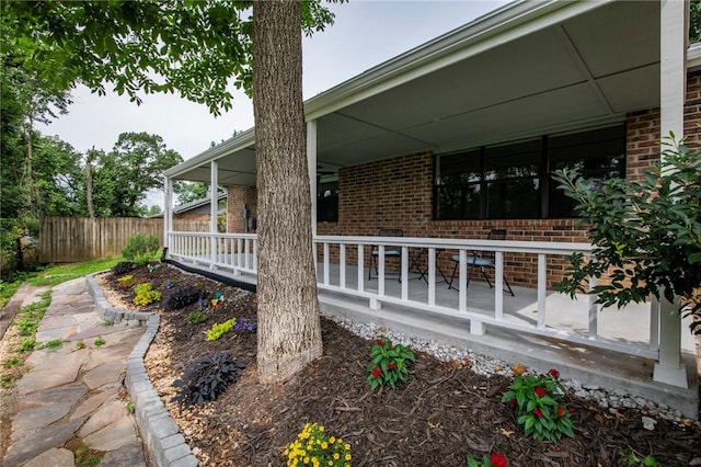 707 Turtle Creek Dr, Rogers, AR 72756 - view of home's exterior featuring brick siding and a porch
