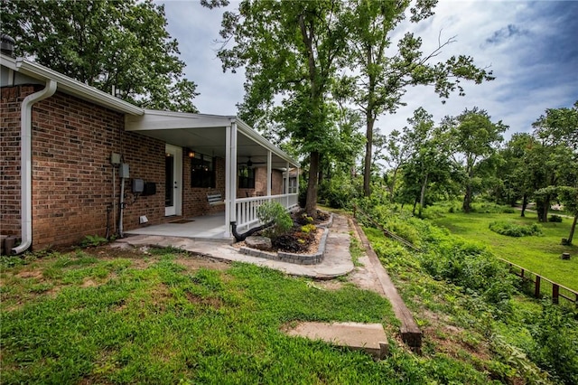 707 Turtle Creek Dr, Rogers, AR 72756 - view of grassy yard featuring covered porch