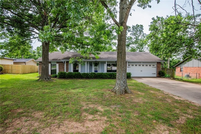 707 Turtle Creek Dr, Rogers, AR 72756 - ranch-style home with concrete driveway, brick siding, and an attached garage