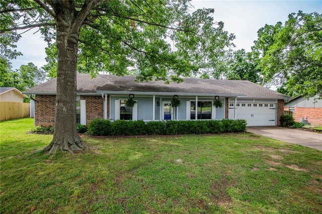 707 Turtle Creek Dr, Rogers, AR 72756 - ranch-style house with brick siding, an attached garage, and concrete driveway