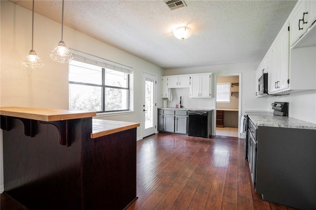 707 Turtle Creek Dr, Rogers, AR 72756 - kitchen with dishwasher, stainless steel microwave, dark wood finished floors, light countertops, and electric range oven