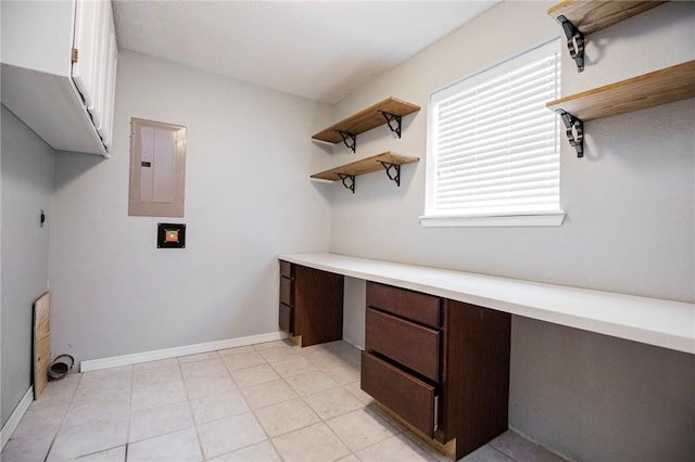707 Turtle Creek Dr, Rogers, AR 72756 - laundry area with electric panel, healthy amount of natural light, a desk, and cabinet space
