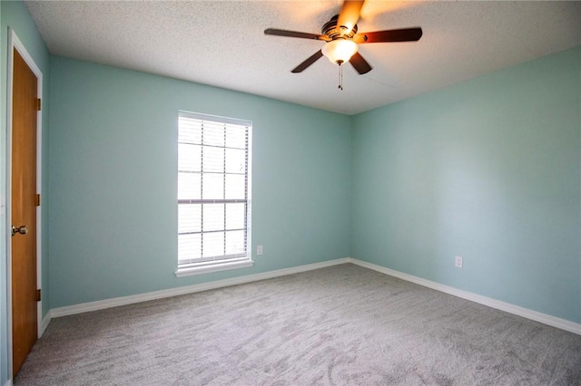 707 Turtle Creek Dr, Rogers, AR 72756 - spare room featuring carpet floors, ceiling fan, and a textured ceiling