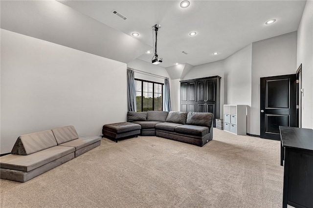 601 Chattin Cir, Bentonville, AR 72713 - carpeted living area with lofted ceiling and recessed lighting