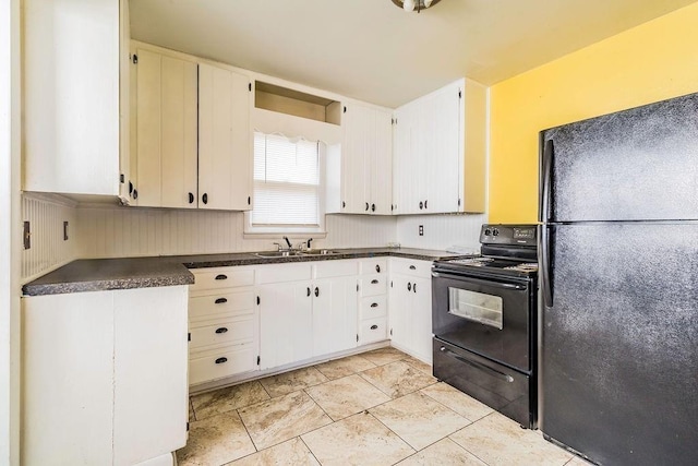 845 S Wright St, Siloam Springs, AR 72761 - kitchen with black appliances, dark countertops, and white cabinetry