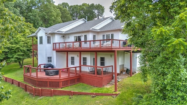 8270 Titleist Cir, Rogers, AR 72756 - back of house featuring a wooden deck, a lawn, and roof with shingles