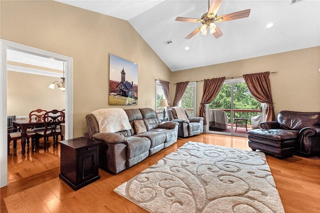8270 Titleist Cir, Rogers, AR 72756 - living room with ceiling fan, light wood finished floors, high vaulted ceiling, recessed lighting, and a chandelier