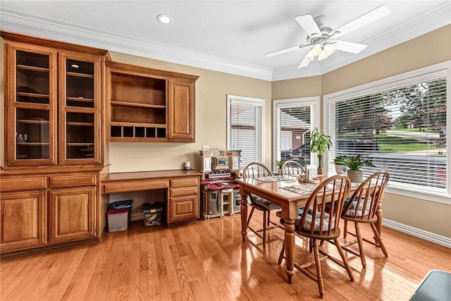8270 Titleist Cir, Rogers, AR 72756 - dining area featuring light wood finished floors, crown molding, an office area, ceiling fan, and recessed lighting