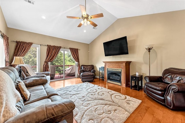 8270 Titleist Cir, Rogers, AR 72756 - living area with a ceiling fan, wood finished floors, a fireplace, high vaulted ceiling, and recessed lighting