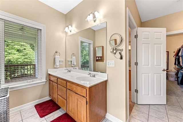 8270 Titleist Cir, Rogers, AR 72756 - full bathroom featuring tile patterned floors, double vanity, lofted ceiling, and a closet