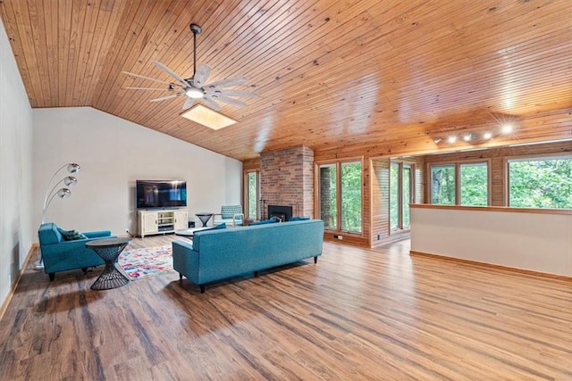 20 Kirkcudbright, Bella Vista, AR 72715 - living area with wooden ceiling, a ceiling fan, wood finished floors, vaulted ceiling, and a fireplace