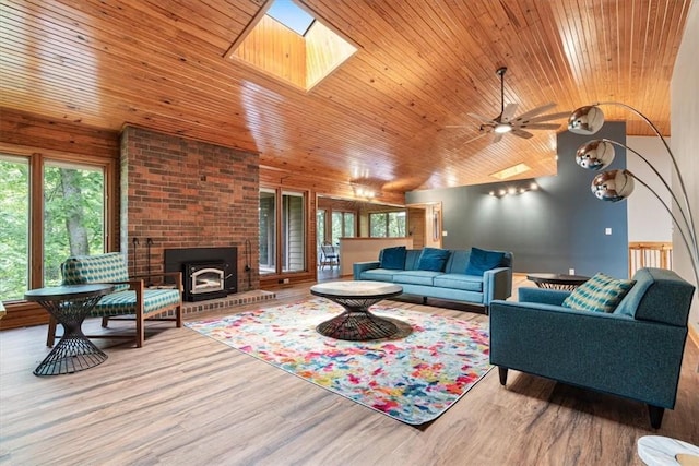 20 Kirkcudbright, Bella Vista, AR 72715 - living area featuring wooden ceiling, wood finished floors, a skylight, and ceiling fan