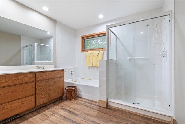 20 Kirkcudbright, Bella Vista, AR 72715 - full bath with vanity, a stall shower, wood finished floors, a bath, and recessed lighting