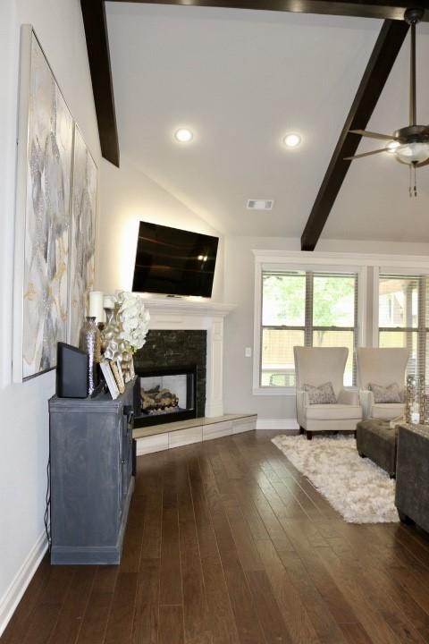 1730 Helen Ln, Bentonville, AR 72713 - living room featuring wood finished floors, a ceiling fan, a fireplace with raised hearth, and recessed lighting