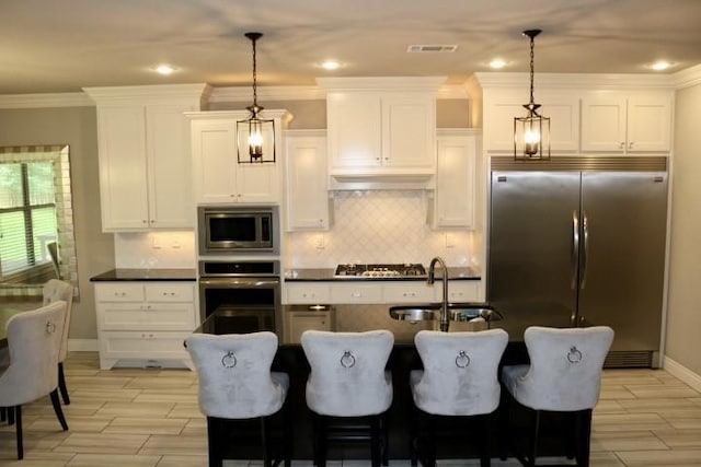 1730 Helen Ln, Bentonville, AR 72713 - kitchen featuring built in appliances, tasteful backsplash, dark countertops, white cabinets, and ornamental molding