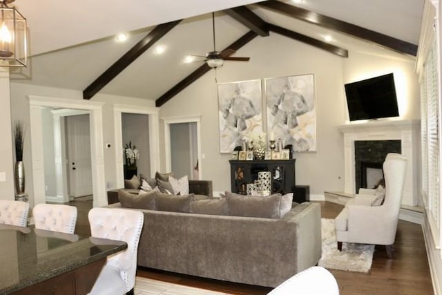 1730 Helen Ln, Bentonville, AR 72713 - living area featuring beamed ceiling, a ceiling fan, a high end fireplace, wood finished floors, and high vaulted ceiling