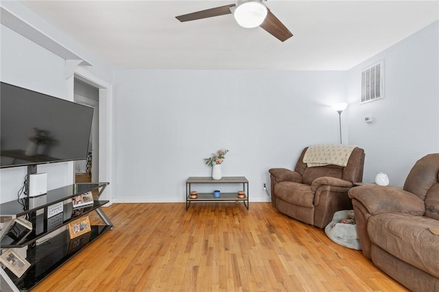 224 N Allen St, Harrison, AR 72601 - living area with light wood-type flooring and ceiling fan