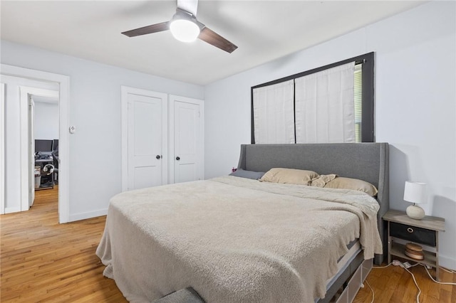 224 N Allen St, Harrison, AR 72601 - bedroom with light wood-style floors, a ceiling fan, and a closet
