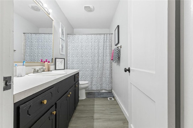 224 N Allen St, Harrison, AR 72601 - bathroom featuring vanity, wood finished floors, and curtained shower