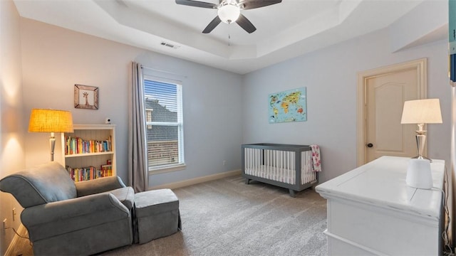 4903 S Inglewood Rd, Rogers, AR 72758 - bedroom with light carpet, a raised ceiling, ceiling fan, and a nursery area