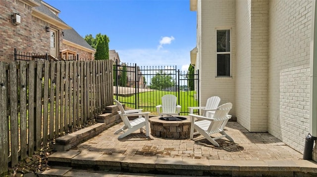 4903 S Inglewood Rd, Rogers, AR 72758 - view of patio with an outdoor fire pit