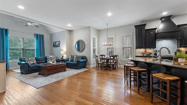 4903 S Inglewood Rd, Rogers, AR 72758 - living area with light wood-type flooring, a ceiling fan, a chandelier, recessed lighting, and vaulted ceiling