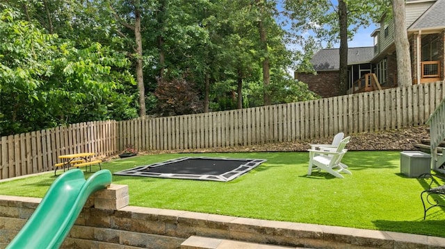 4903 S Inglewood Rd, Rogers, AR 72758 - fenced backyard featuring a trampoline