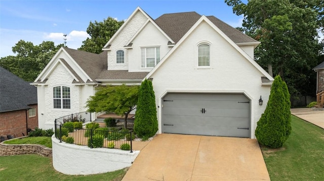 4903 S Inglewood Rd, Rogers, AR 72758 - traditional home featuring a garage, a shingled roof, and driveway