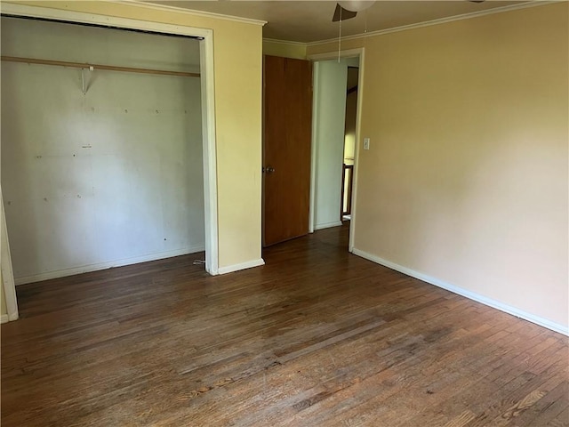 1445 Viewpoint Dr, Fayetteville, AR 72701 - unfurnished bedroom featuring dark wood-style flooring, a closet, and crown molding