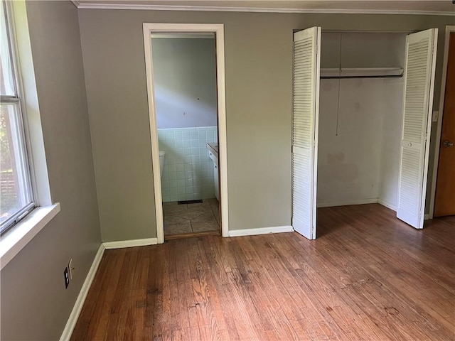 1445 Viewpoint Dr, Fayetteville, AR 72701 - unfurnished bedroom with hardwood / wood-style floors, a closet, ornamental molding, and connected bathroom