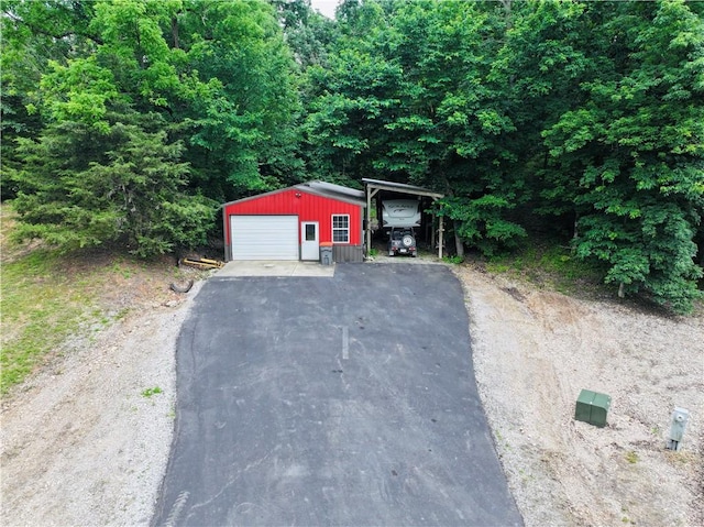 19123 Nokes Farm Rd, Siloam Springs, AR 72761 - detached garage with driveway and a carport