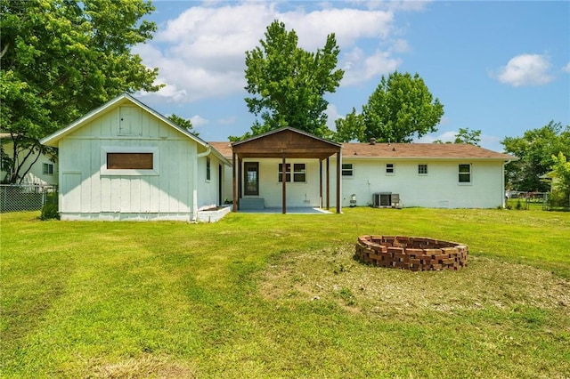 1916 S 12th St, Rogers, AR 72758 - rear view of house featuring a patio area and a fire pit
