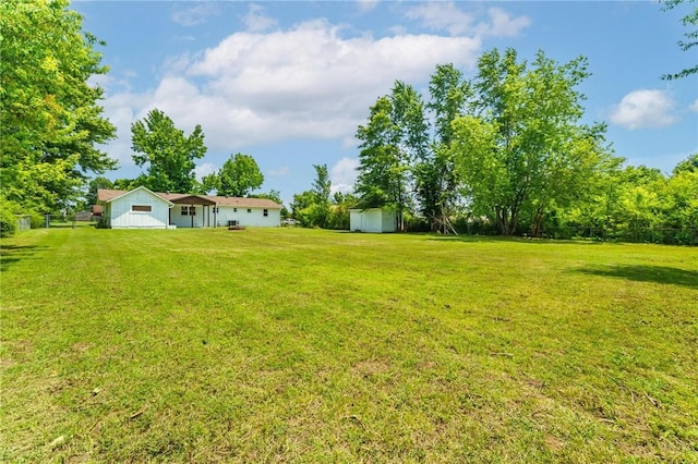 1916 S 12th St, Rogers, AR 72758 - view of green lawn featuring a storage shed