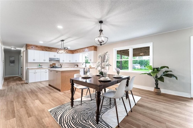 1916 S 12th St, Rogers, AR 72758 - dining area with light wood-style flooring, a textured ceiling, a chandelier, and recessed lighting