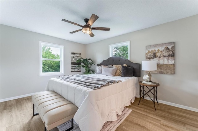 1916 S 12th St, Rogers, AR 72758 - bedroom featuring light wood-style flooring and a ceiling fan