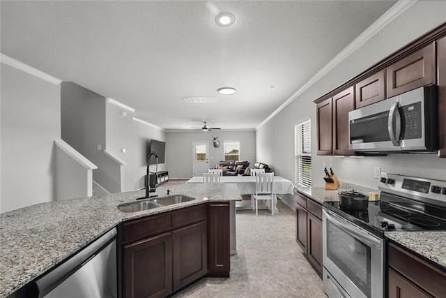 4424 Cornwall St, Springdale, AR 72762 - kitchen with appliances with stainless steel finishes, crown molding, light stone counters, a ceiling fan, and open floor plan