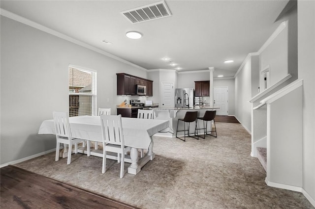 4424 Cornwall St, Springdale, AR 72762 - dining space with ornamental molding and recessed lighting