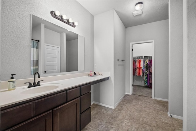 4424 Cornwall St, Springdale, AR 72762 - full bath featuring vanity, a spacious closet, and tile patterned flooring