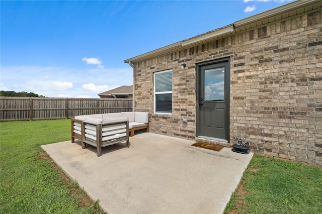 4424 Cornwall St, Springdale, AR 72762 - view of exterior entry with a patio area, an outdoor living space, and brick siding